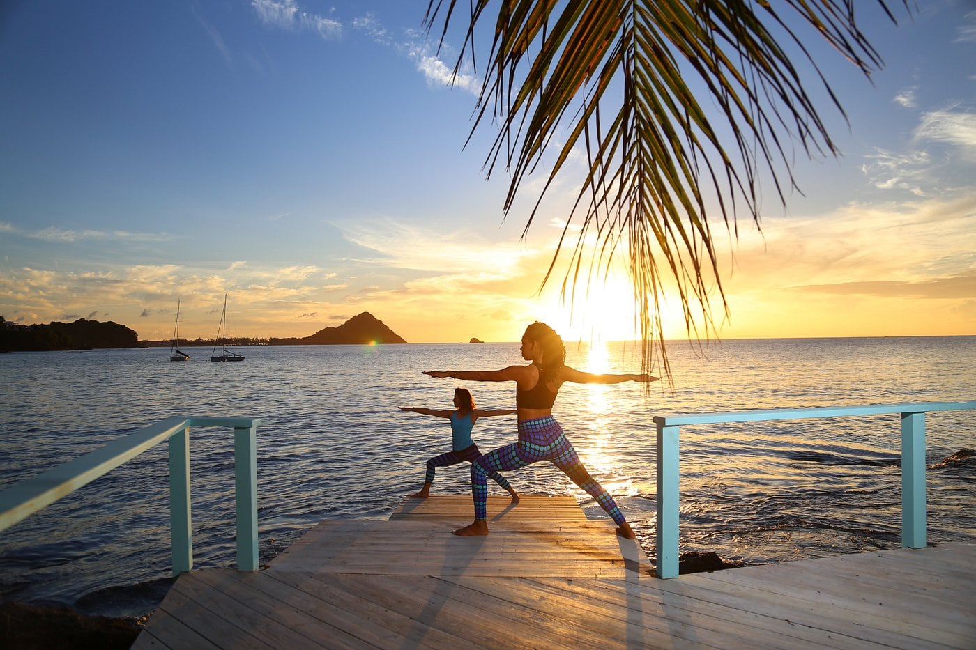 woman doing yoga at sunset
