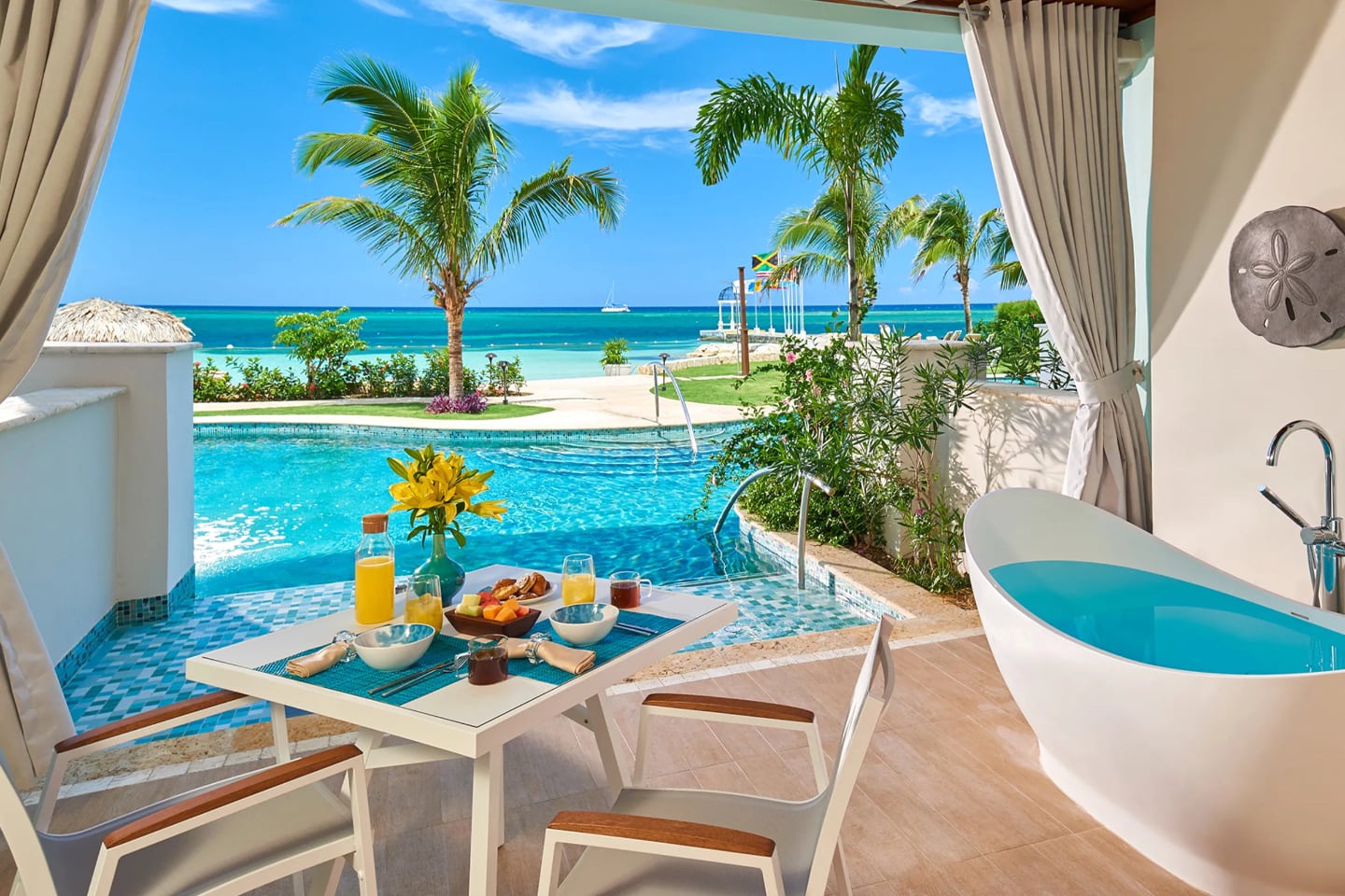 luxury resort suite overlooking pool with sea view