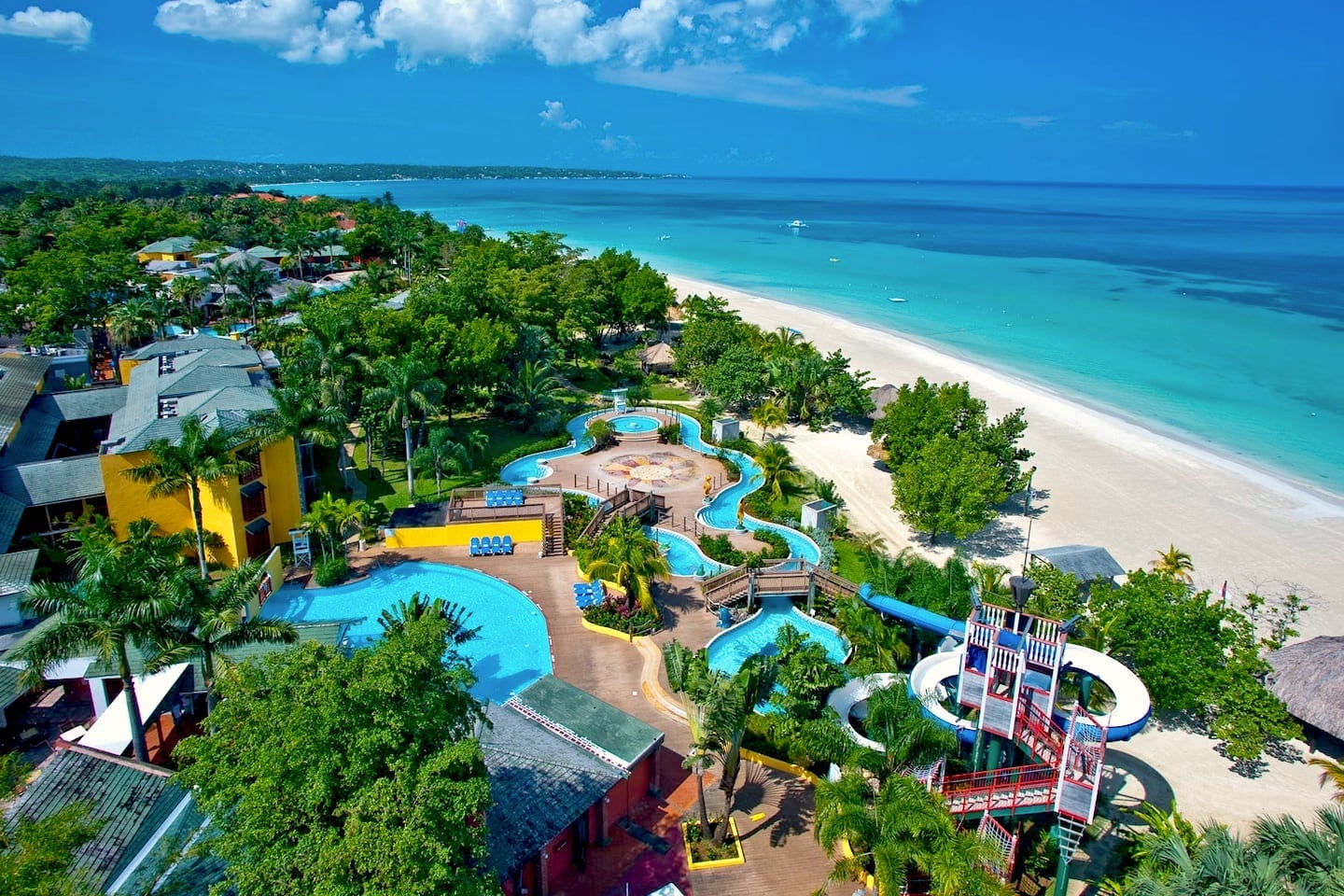 waterslide and white sands beach at Caribbean all inclusive family resort