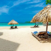 thatch beach umbrellas at one of the top Jamaica adults-only all-inclusive resorts