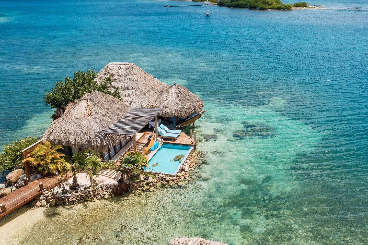 overwater bungalows in the Caribbean with private pool and sea views in Aruba