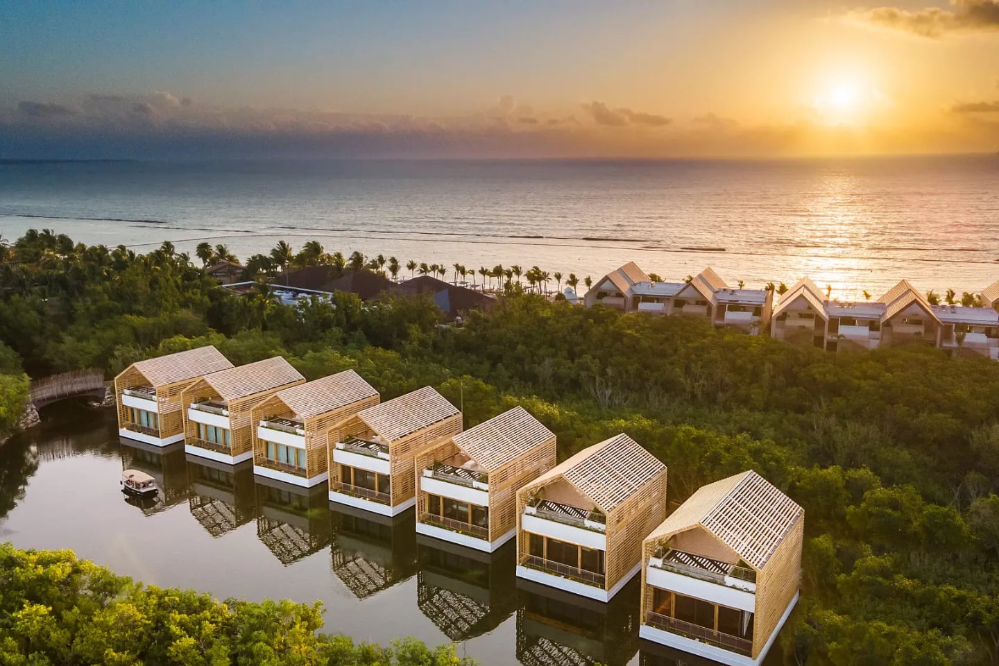 sunset over Caribbean and Banyan Tree Mayakoba water villas