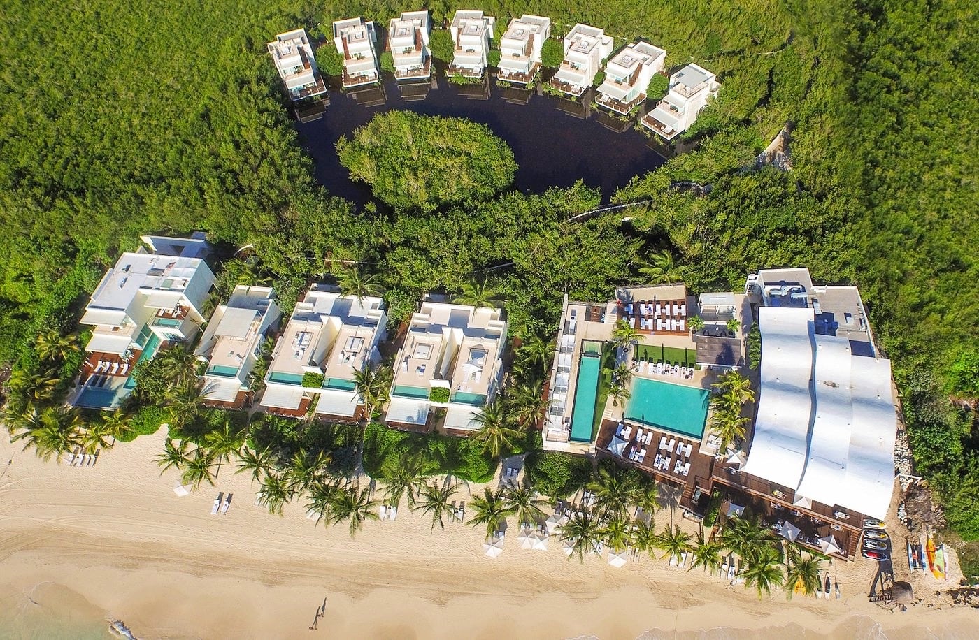 Caribbean water bungalows around a lagoon in Mexico