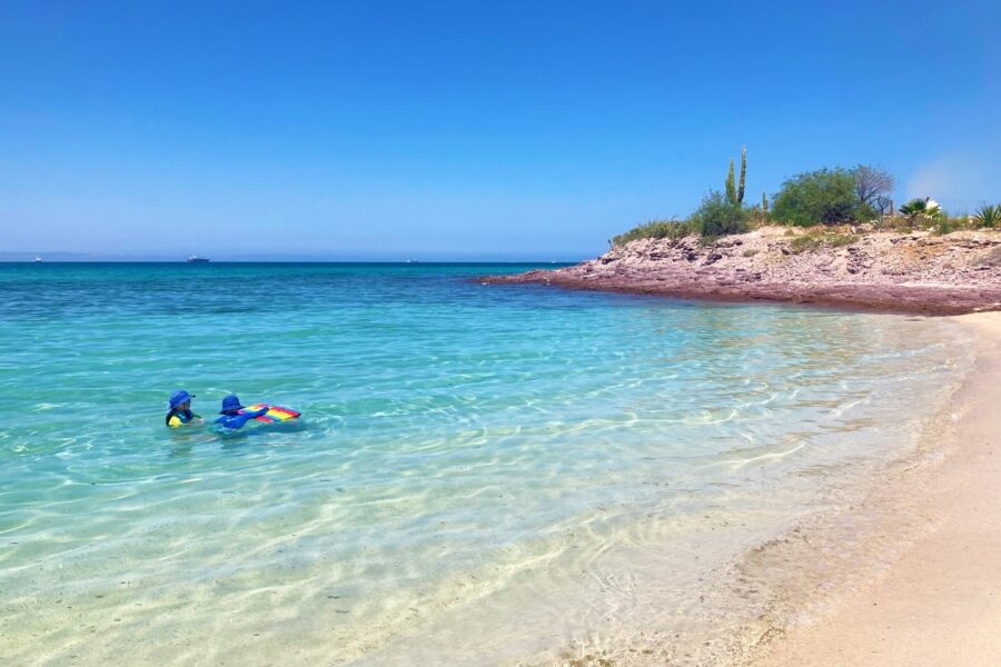 children playing in clear water in La Paz BCS