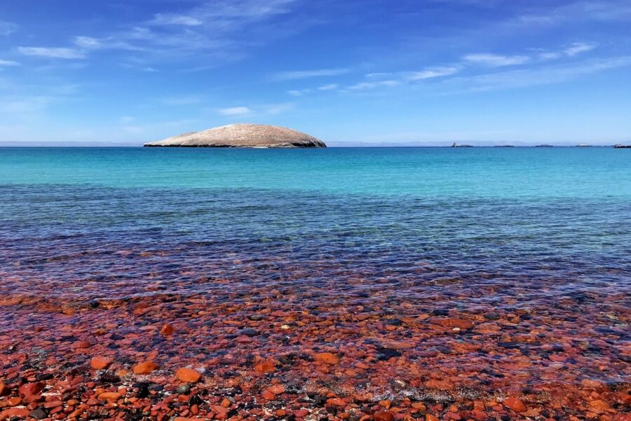 red rocks and water with White Island