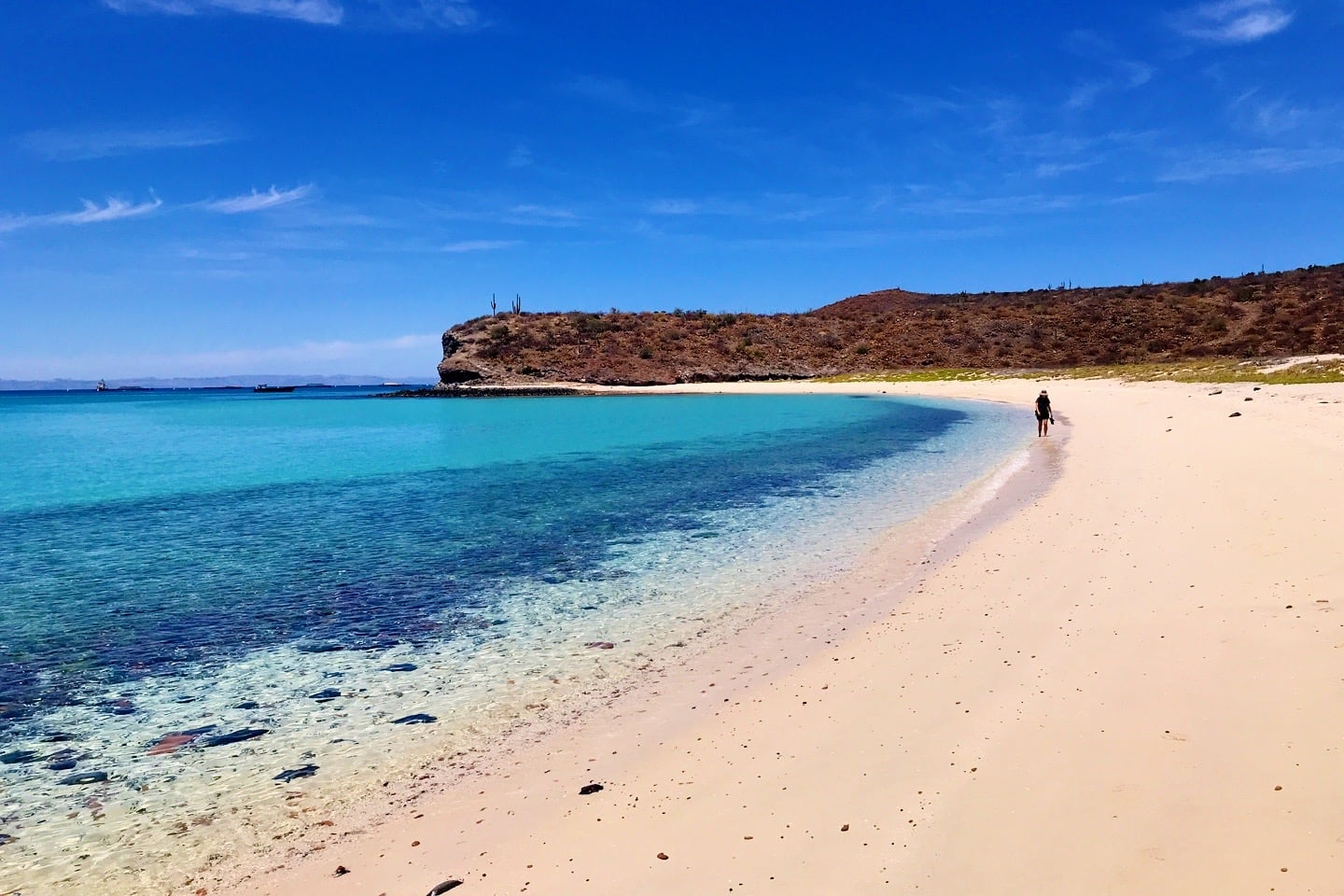 person walking on Playa Las Gaviotas near La Paz Mexico