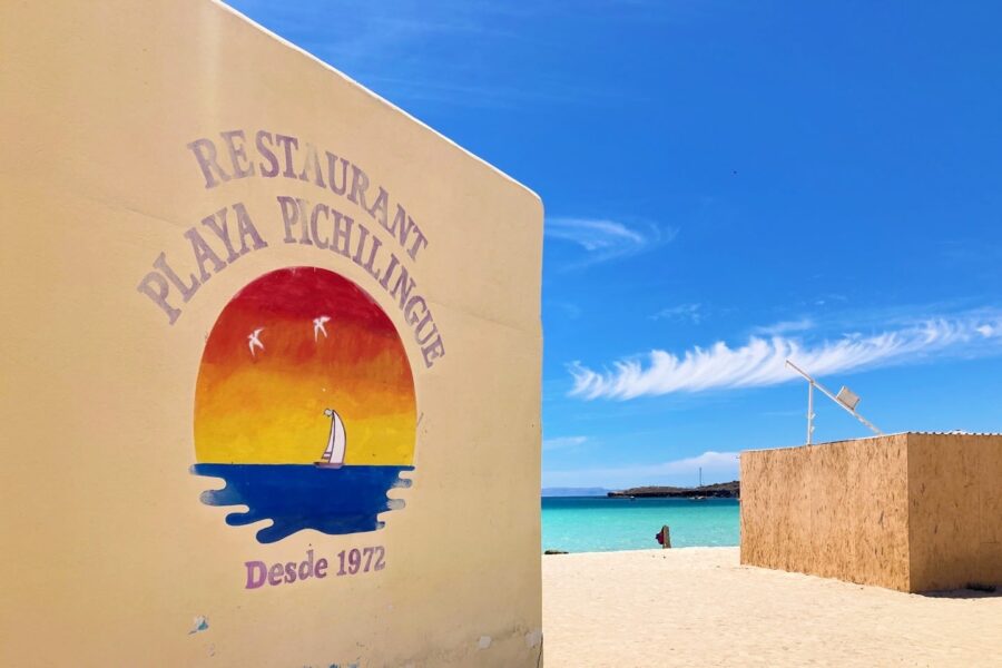 restaurant sign near beach