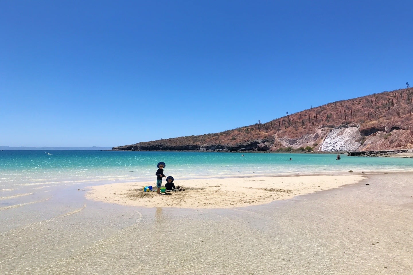 children playing at Playa Pichilingue near Port of La Paz Mexico