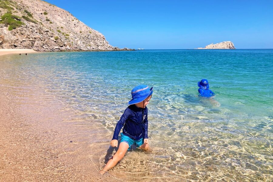 children playing in clear water at Playa Saltito La Paz beaches