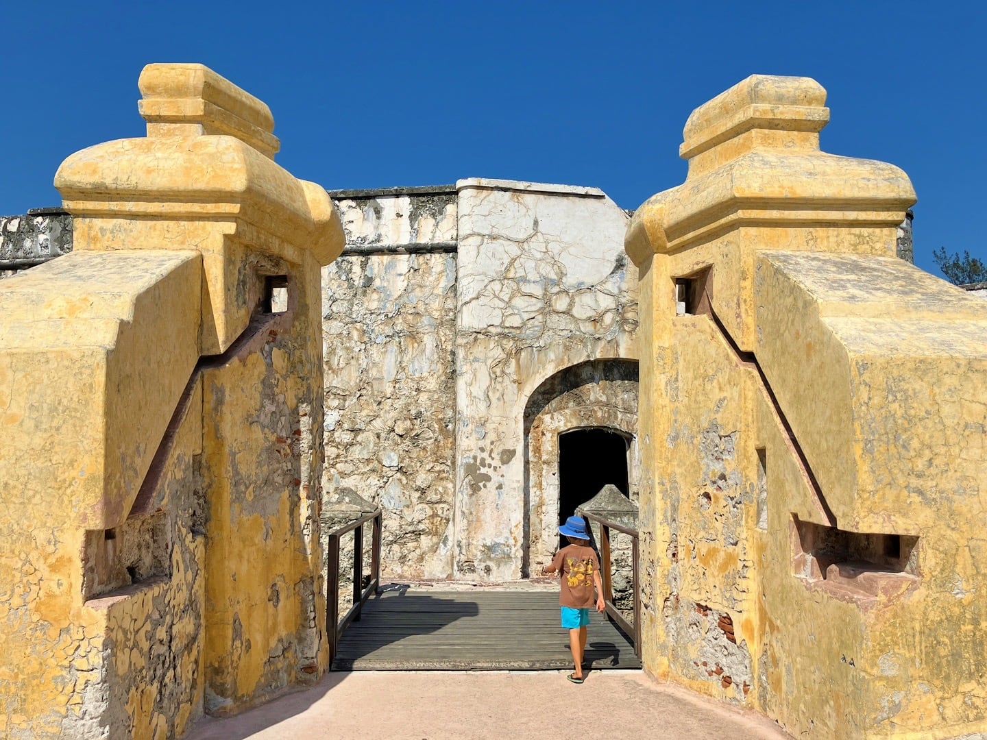 yellow gates and draw bridge to fortress