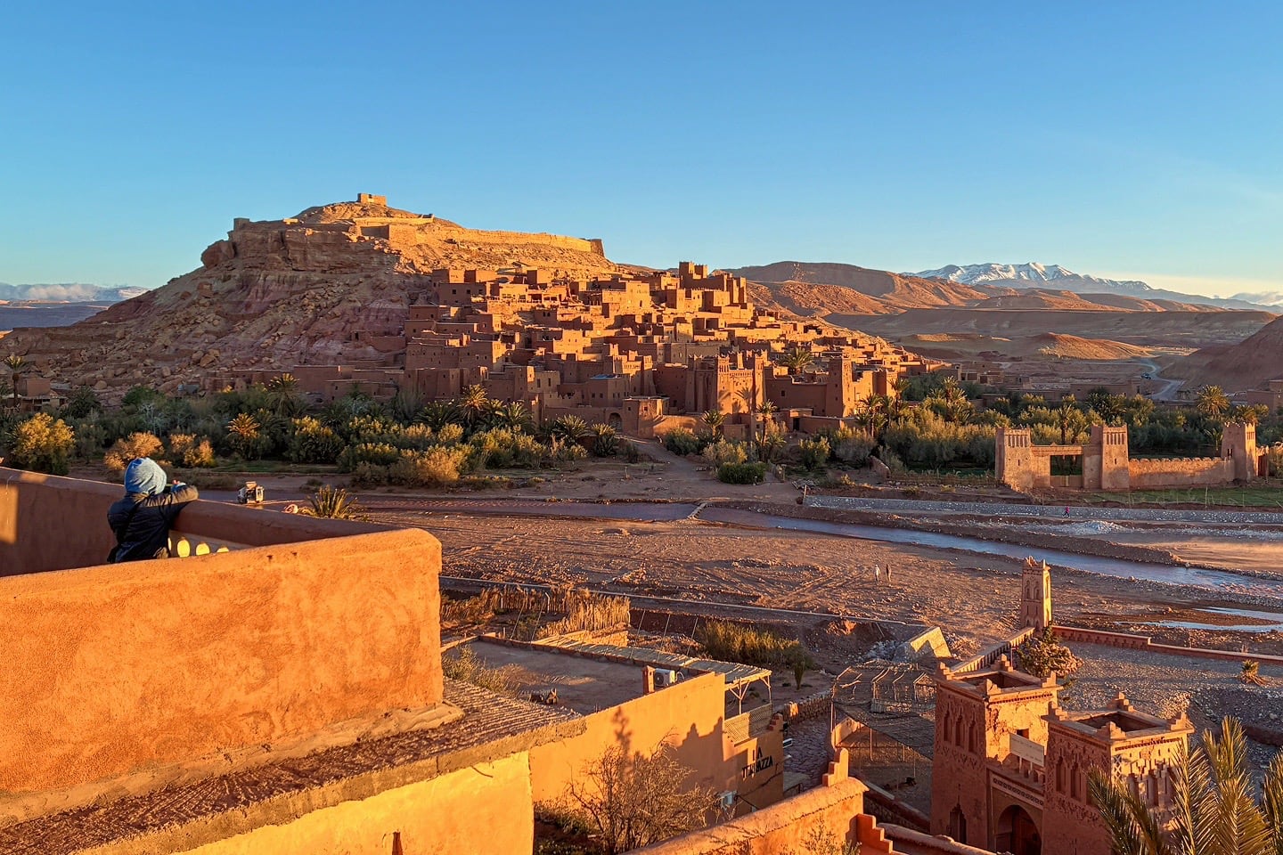 view of Ait Benhaddou and Atlas Mountains at sunrise