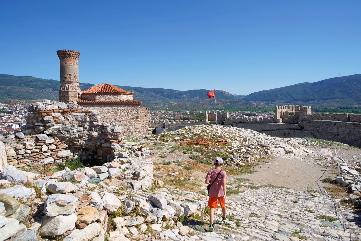 person walking on top of Ayasuluk Citadel in Selcuk Turkey