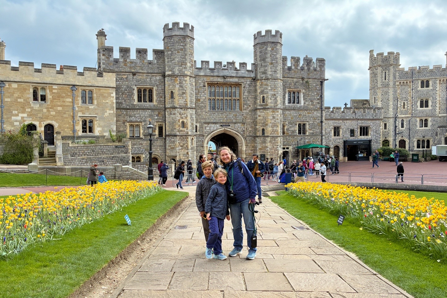 standing inside one of the main courtyards after traveling from London to Windsor Castle
