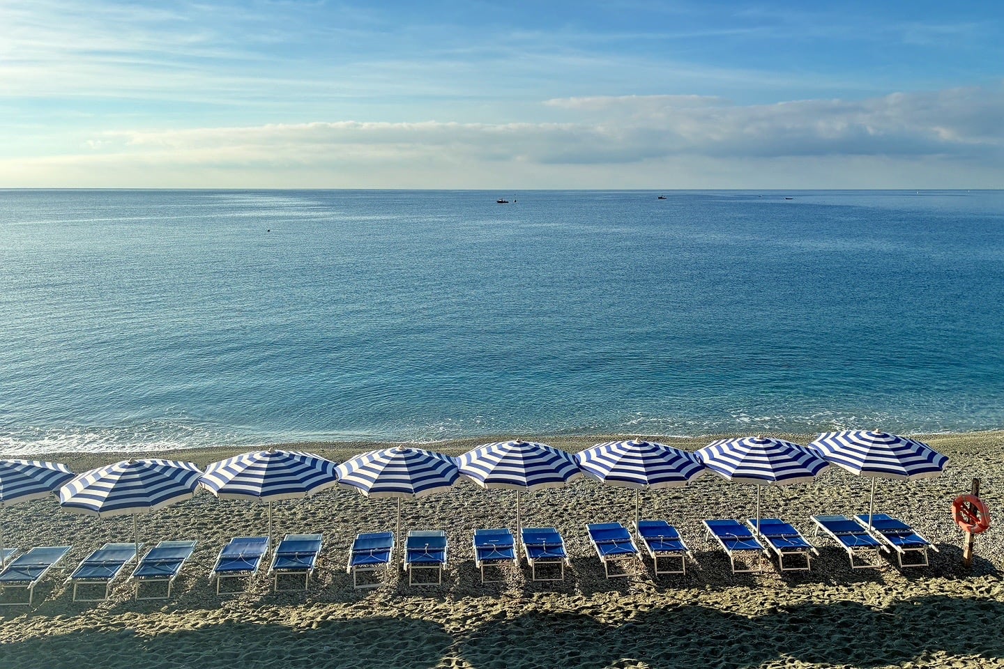 umbrellas and chairs on beach Cinque Terre Italy